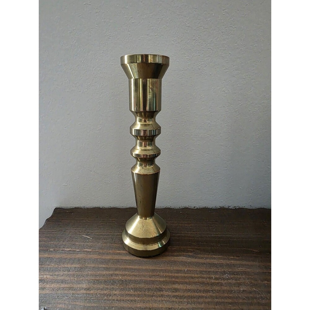 Vintage turned brass candlestick holder measuring approximately 7.25 inches tall